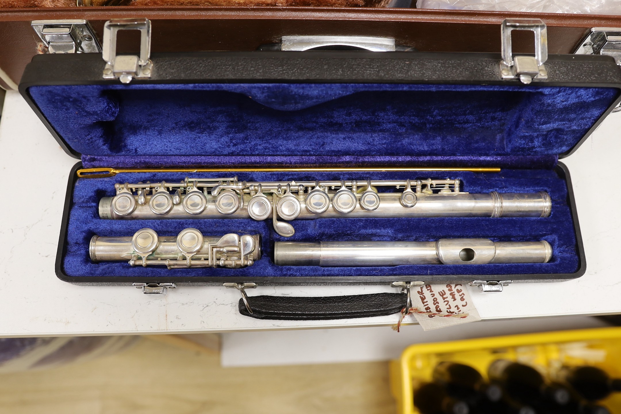 A Yamaha saxophone and a cased Arbiter flute (2)